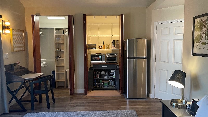 Motion activated lights in the closets light up when the doors open. One closet is for your personal items, and one houses the kitchenette. 