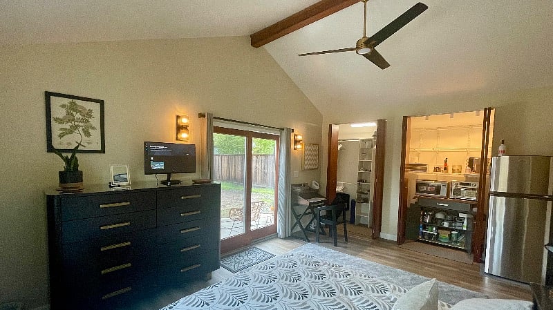 View from the bed. Fast ceiling fan with remote control can be run in reverse in the winter to bring the heat down.