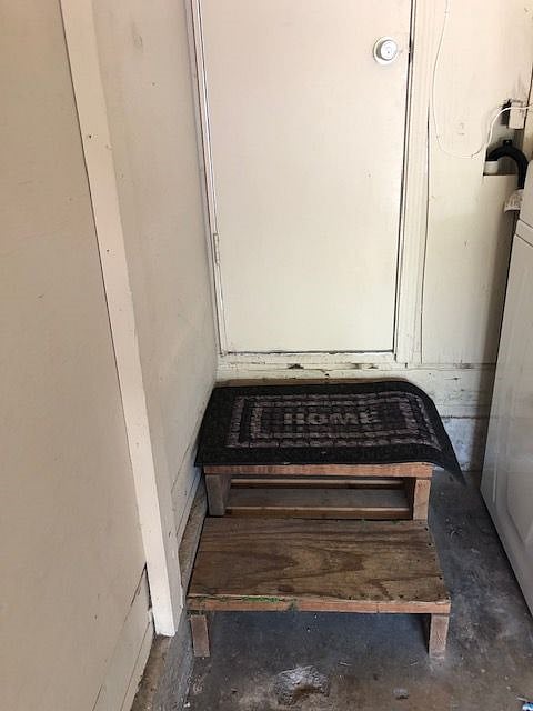 Stairs to garage for laundry facility