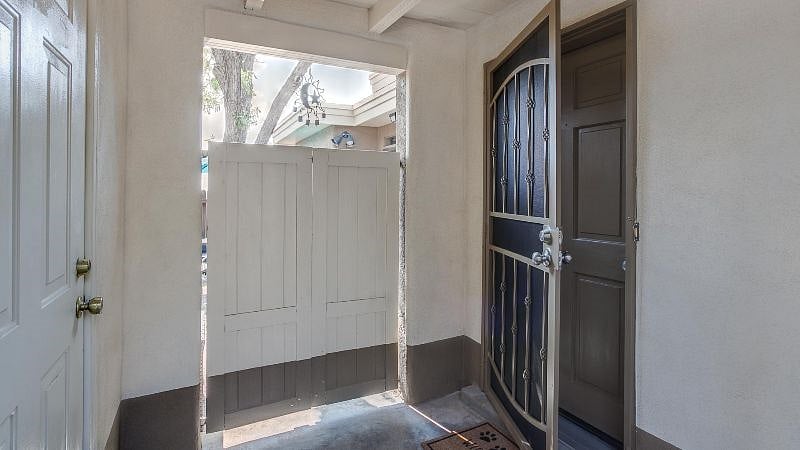 Covered front door to Right, exterior entry to patio