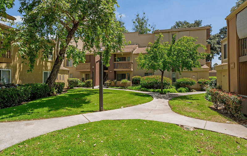 Green space with walking trail throughout the complex