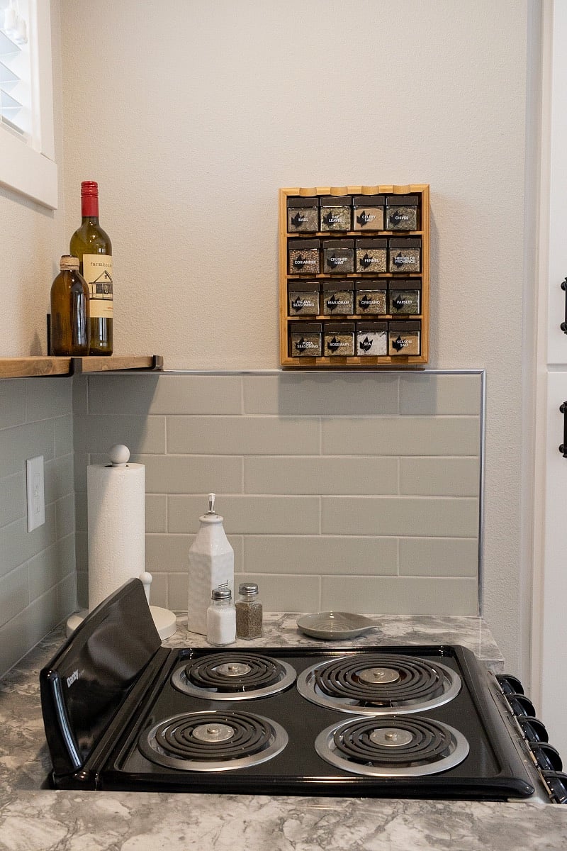 Granite countertop, range/oven, spice rack, etc.