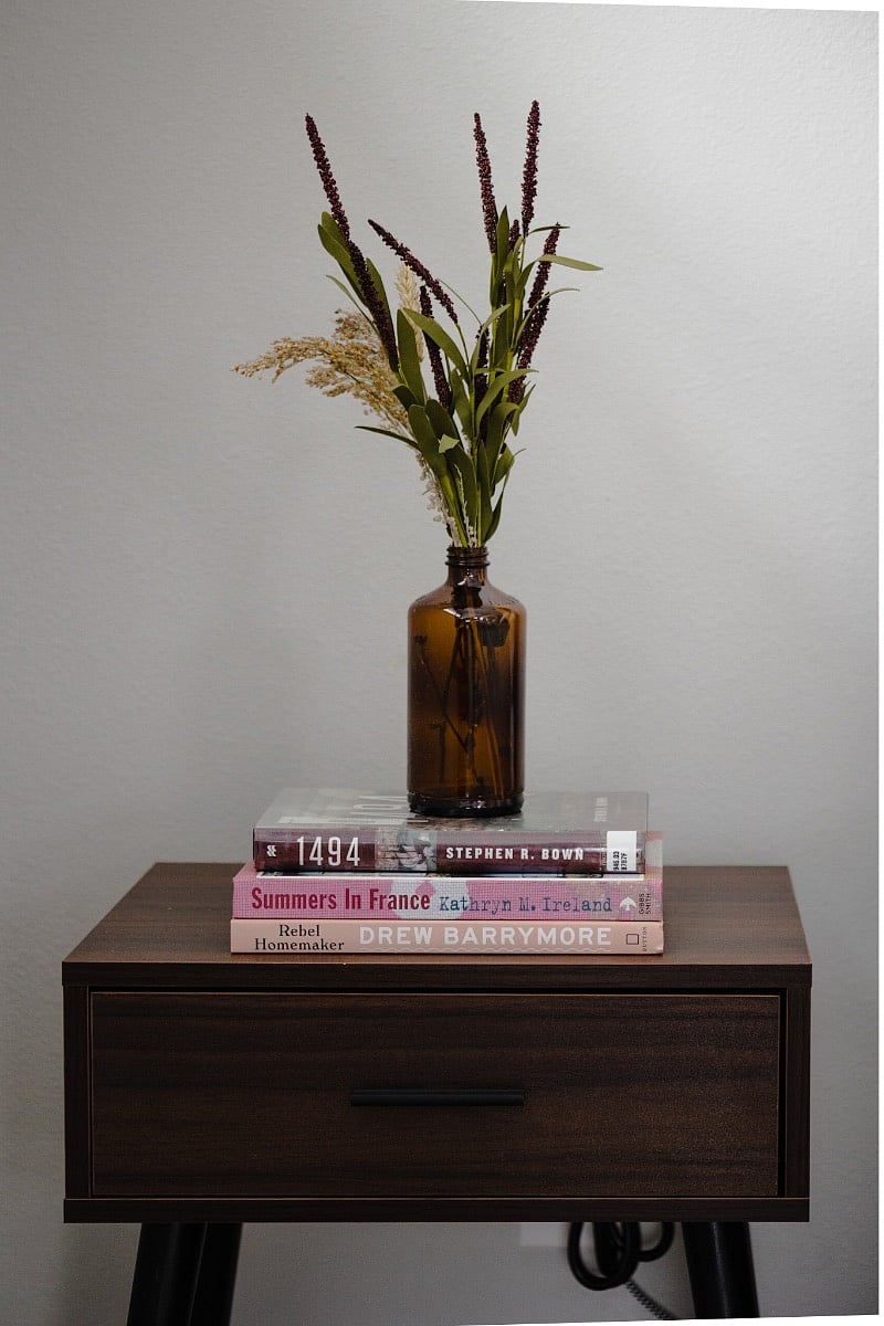 Nightstand with storage and extra outlets next to bed