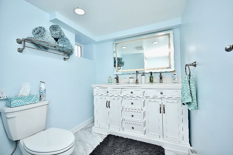 Downstairs full-size bathroom #2. Includes LED mirror, hair dryer, and walk-in shower. 