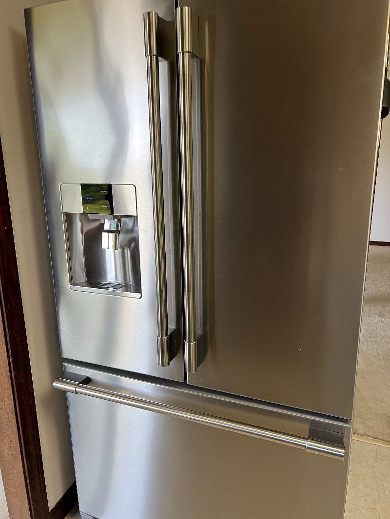 Refrigerator with filtered water and ice maker.