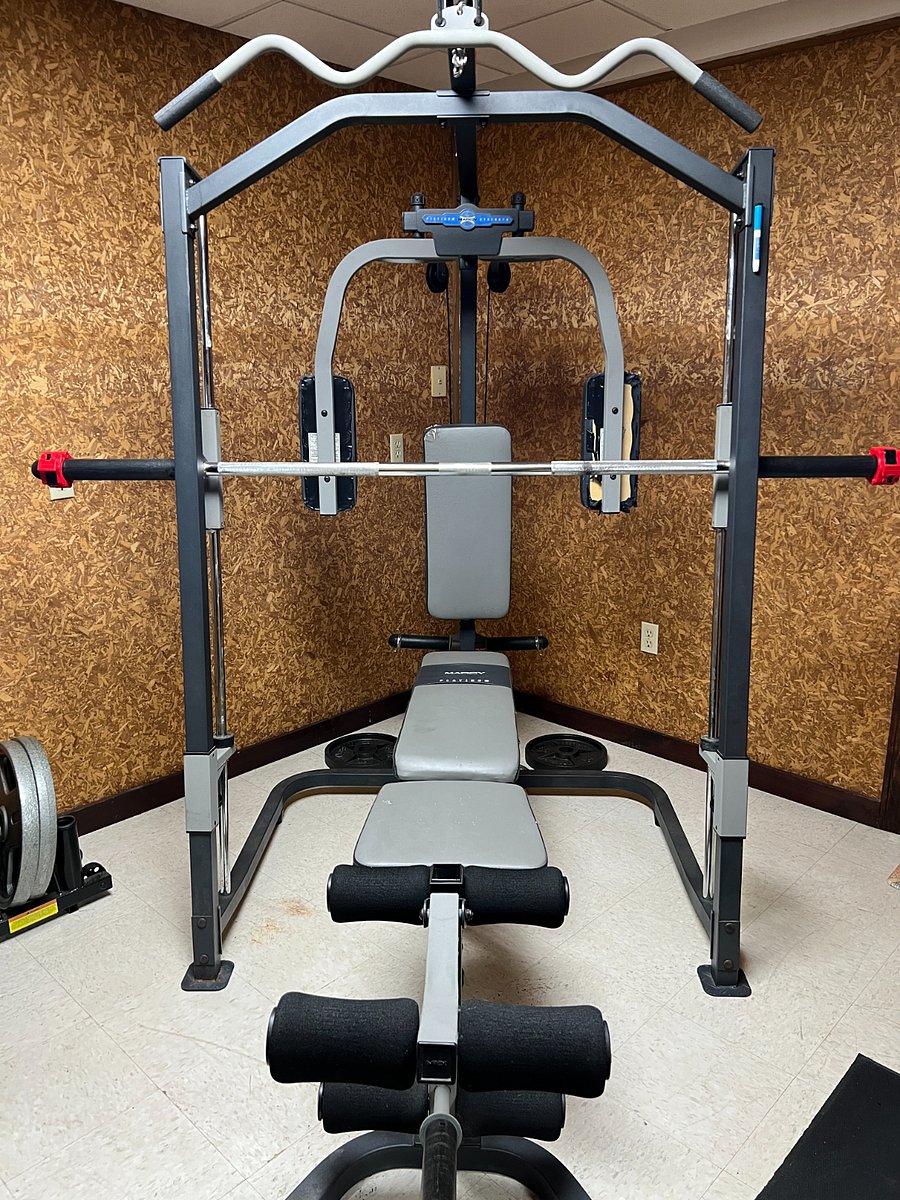 Exercise equipment in private gym room.