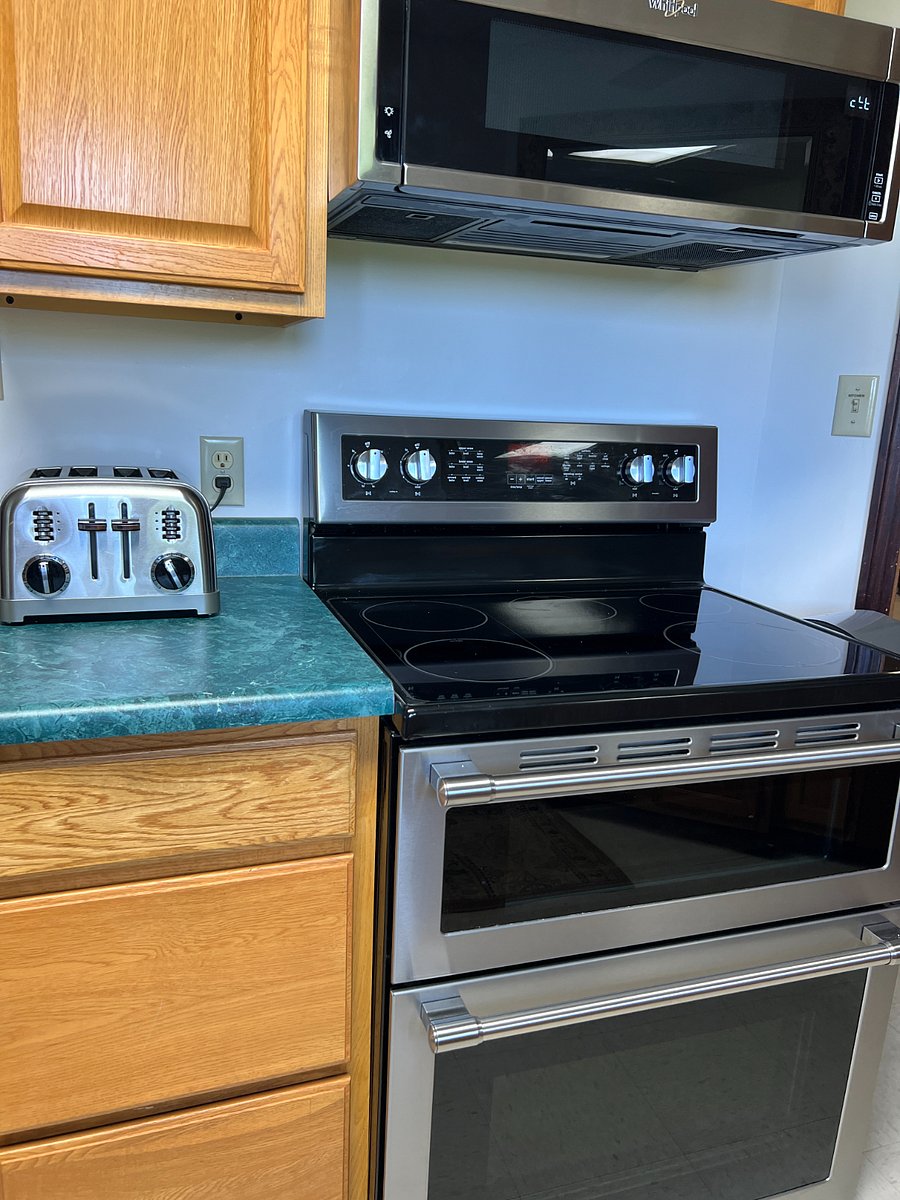 Stove with double ovens and microwave.