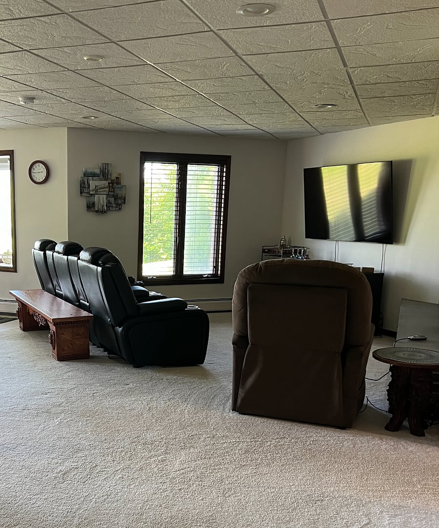 Living room with theater seating and lift recliner with heat and massage.