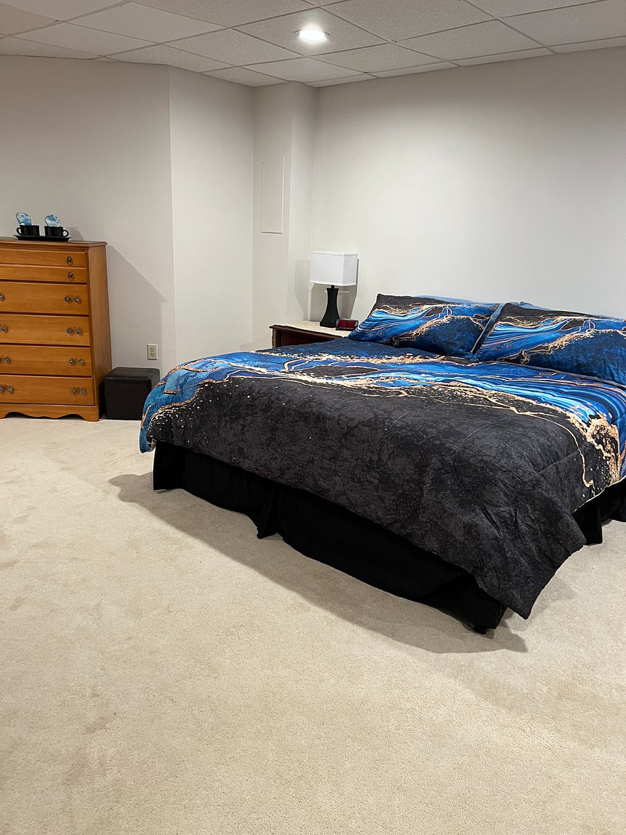 Master bedroom with king size bed.