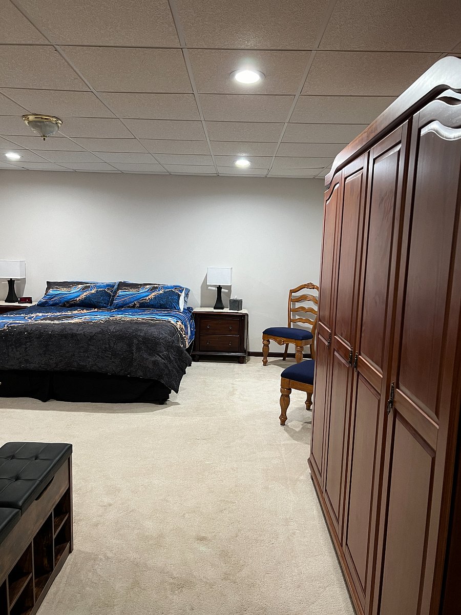 Master bedroom with king size bed. Nigh stands with lamps and usb plugs.