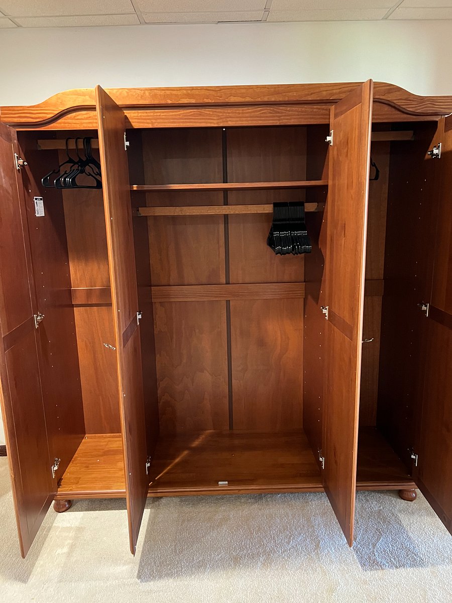 Large armoire in master bedroom.