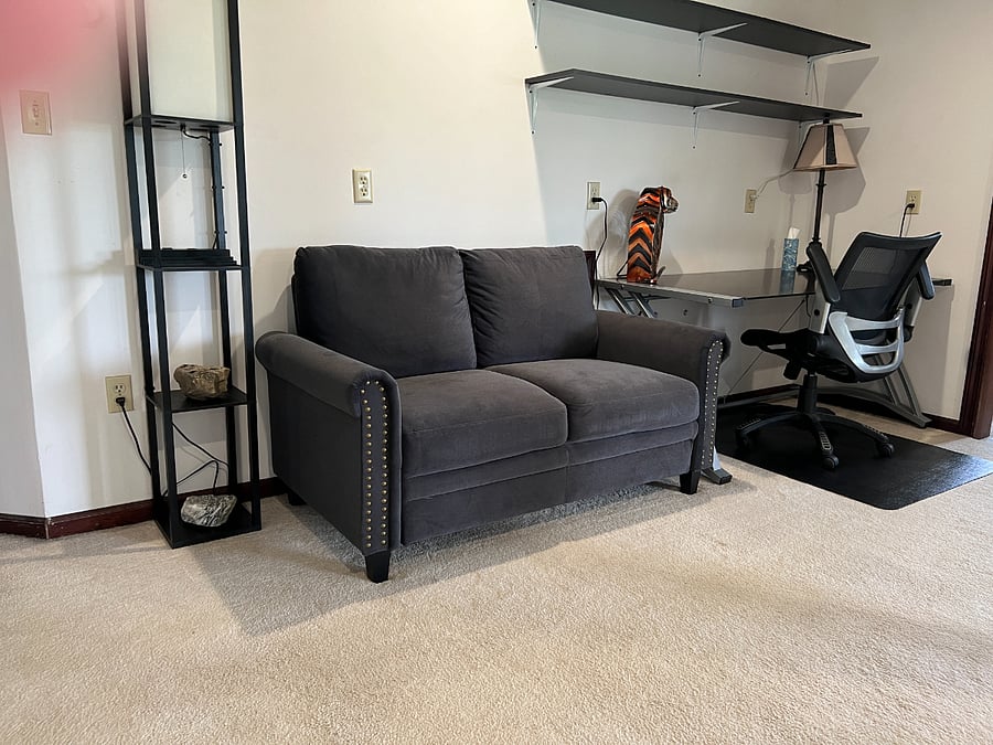 First work space in den area with seating for plenty of room to work.