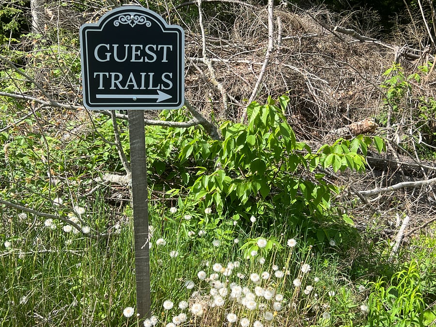 Outdoor trails are marked with signs.