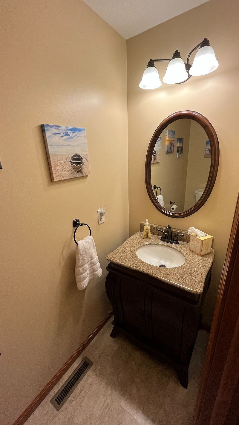 Half bath near the front door for easy access by guests.