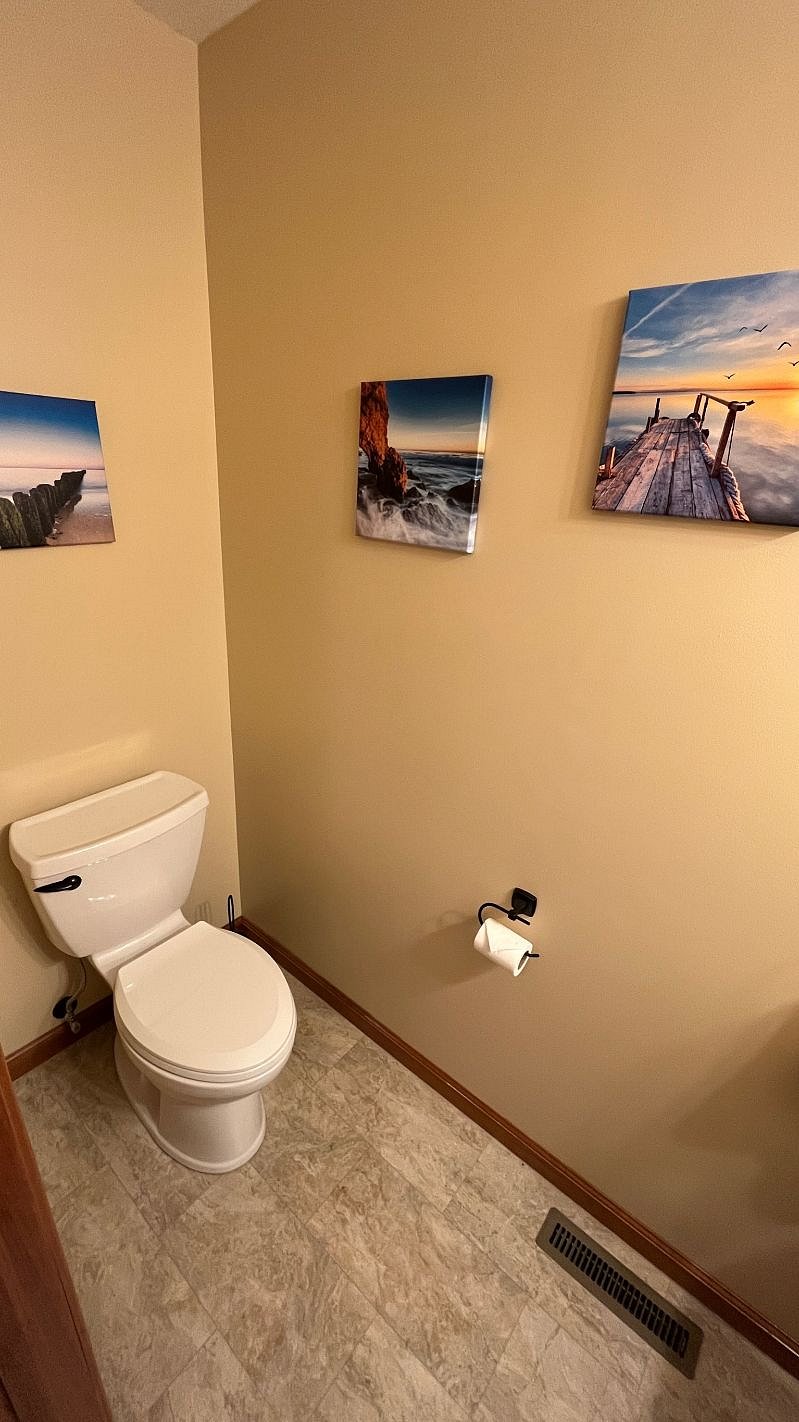 Half bath near the front door for easy access by guests.