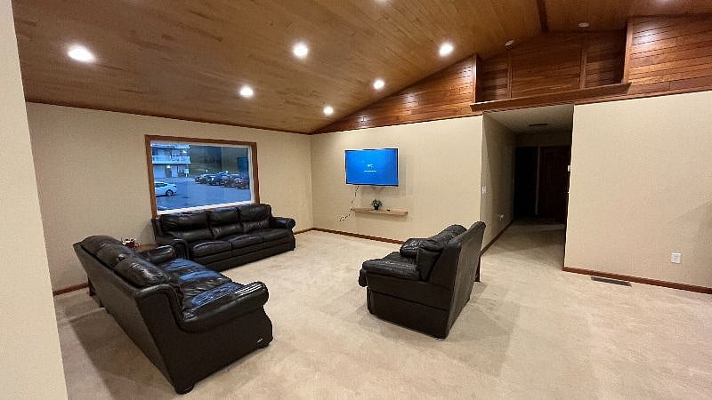 Large 55" mounted TV in Living Room can be easily viewed from the Kitchen and Dining Room as well.