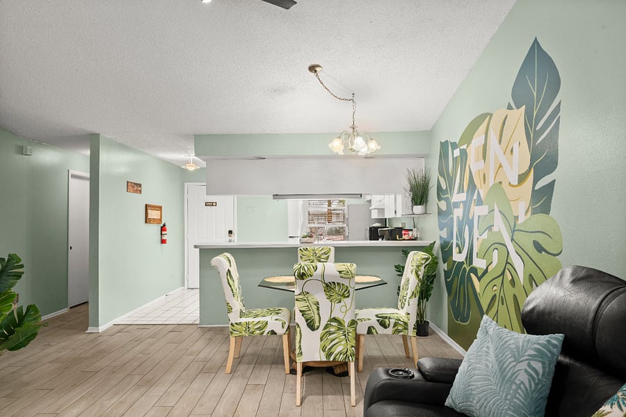 Gather, relax, and feel right at home in the bright living room, featuring soaring high ceilings and an abundance of natural light