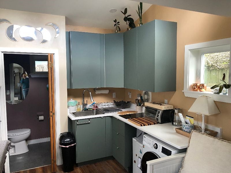 Kitchen and washer/dryer combo.