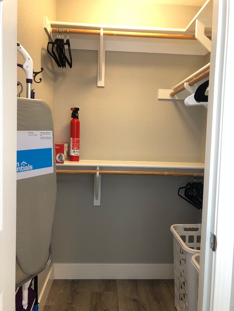 Nice sized walk in closet with cleaning supplies
