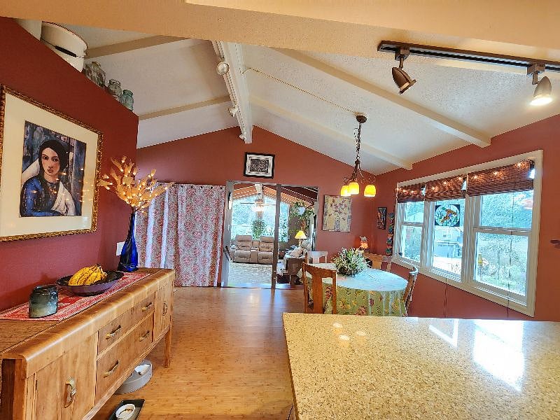 Dining room with extra frig hidden behind curtained area