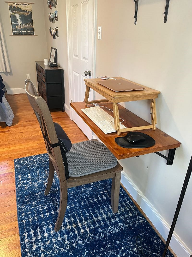 Desk area includes desk stand, external mouse and keyboard