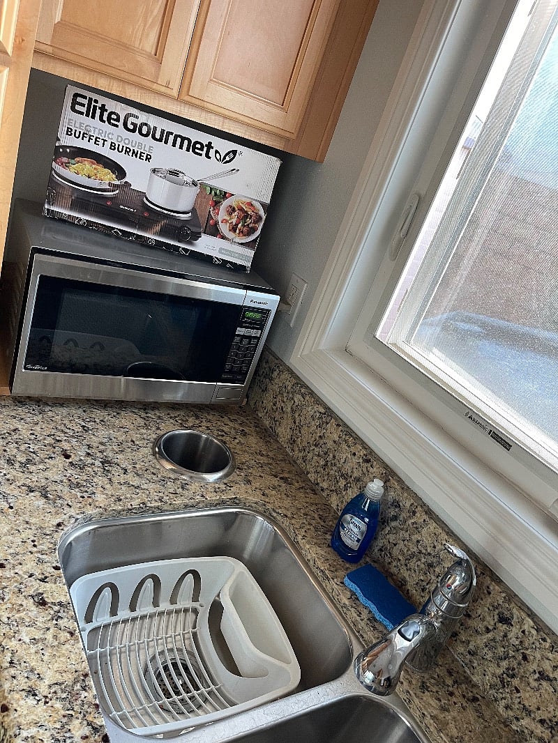 Kitchenette included double sink, microwave, electric double burner, air fryer/toaster oven, coffee pot and all necessary kitchen utensils