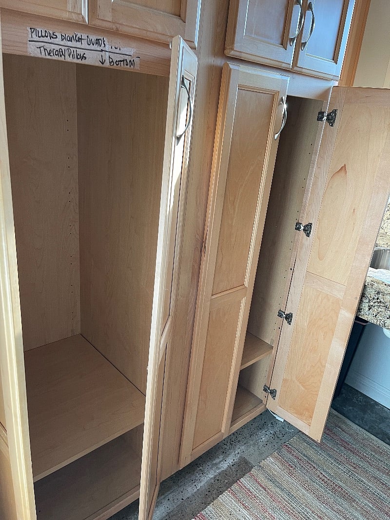 Lots of closet space to hang clothes above closet storage