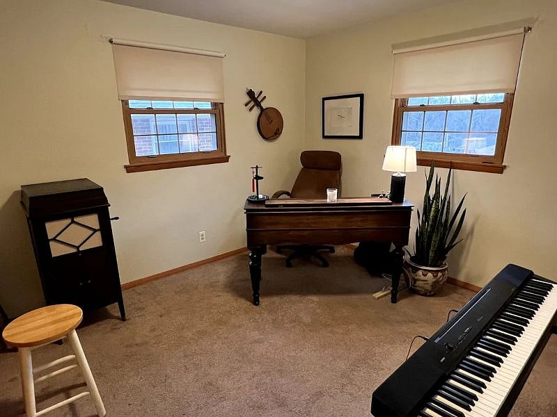 Office / music room includes antique writing desk, plus a working electric piano, and guitar for the musically inclined (or musically curious ;)