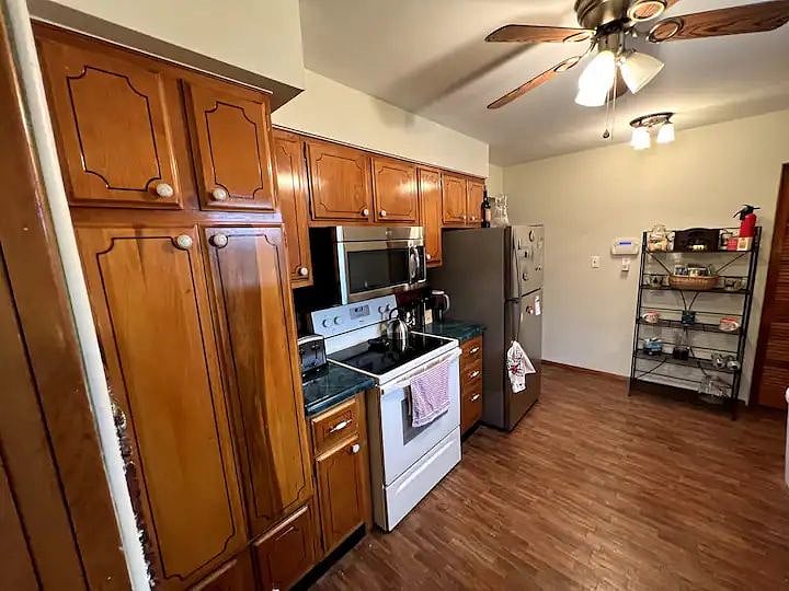 A well-equipped and well-organized kitchen awaits. A single / 2-cup Proctor & Silex coffeemaker, plus various flavors of coffee pods (starter amount) is included.