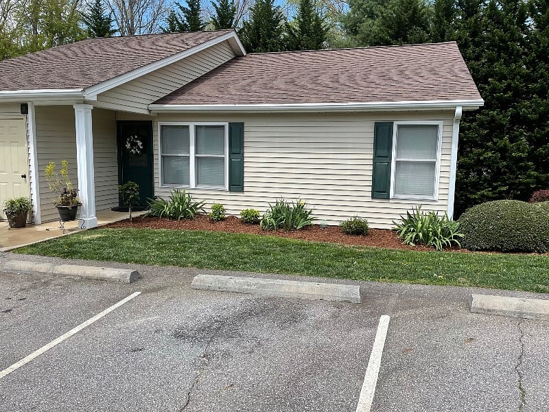 This is the front of the condo building this rental is directly below this one shown with its own private door entrance and patio facing the woods 