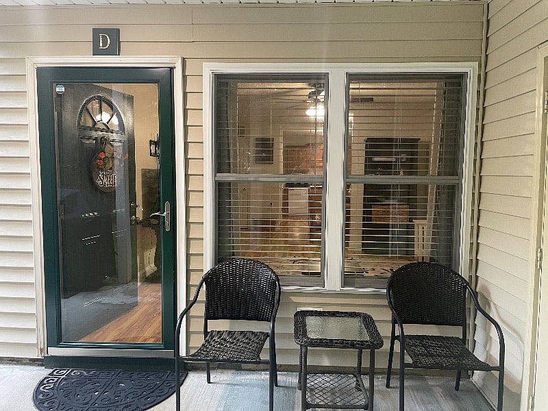 Inviting front porch with chairs and table for your morning cooler or late evening outside enjoyment 