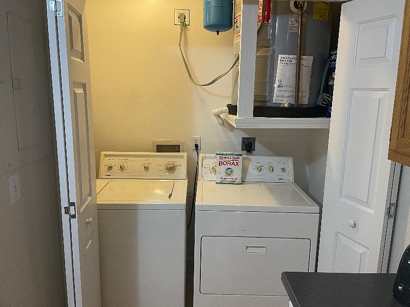 Washer and dryer conveniently located off the kitchen for ease of use.