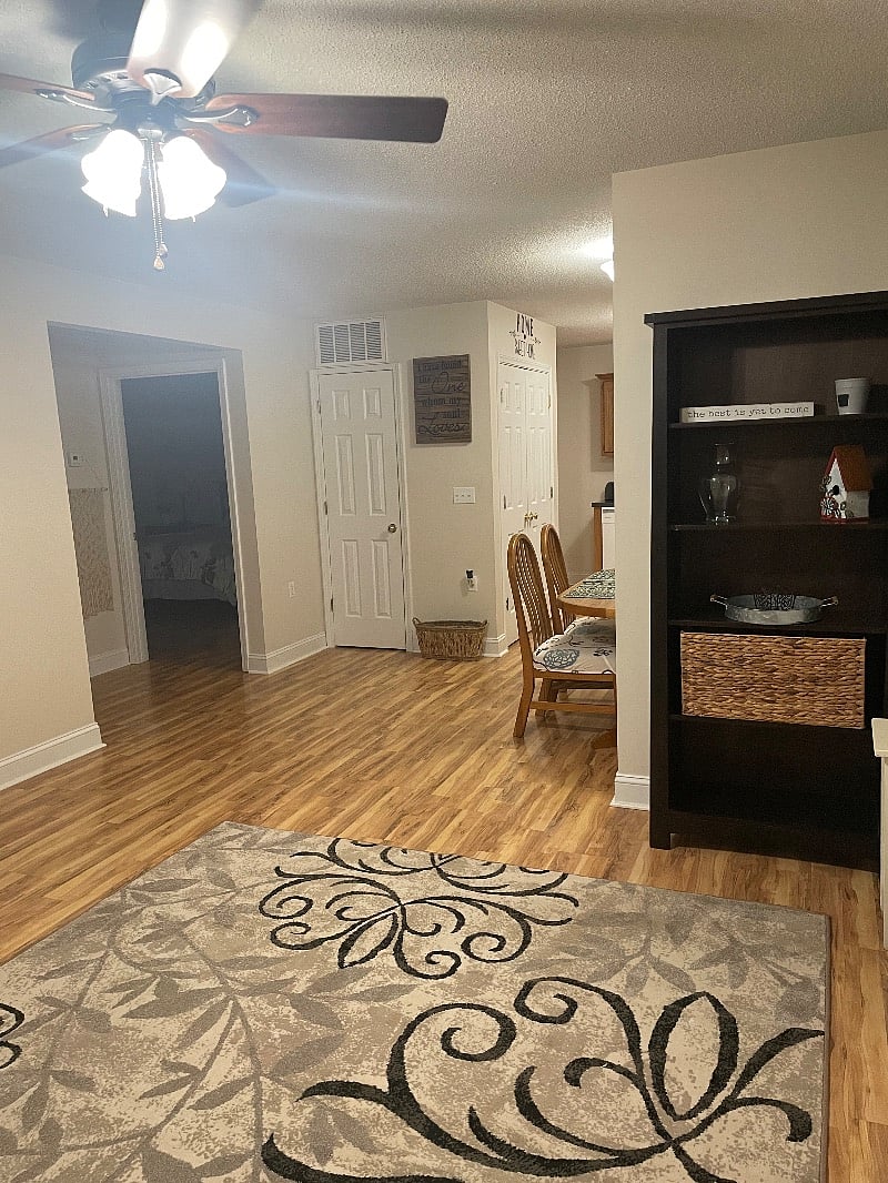 Living room view into bedroom and kitchen