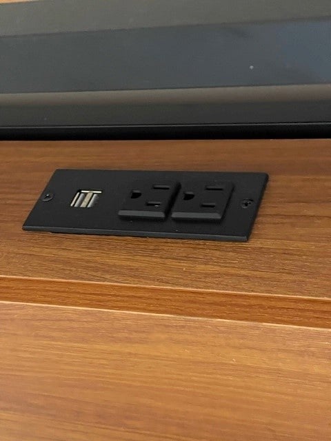 Bed has build in outlets for easy power access
