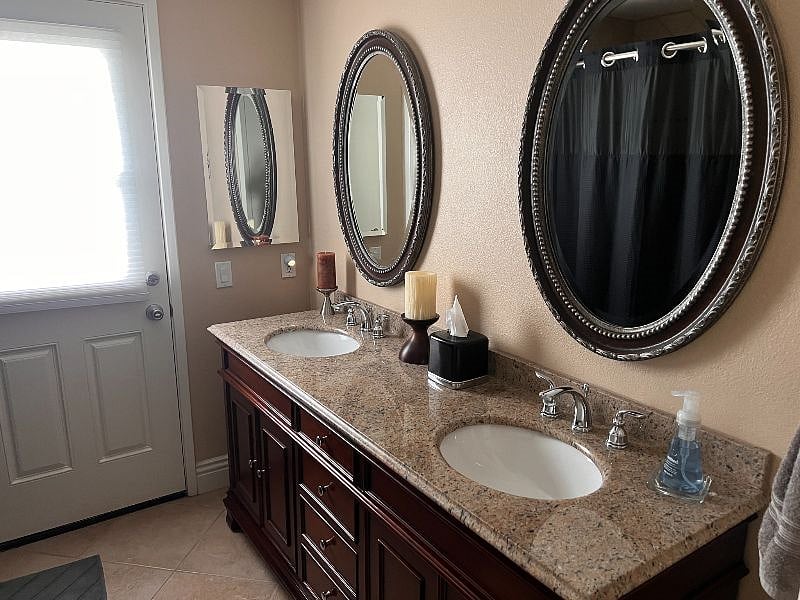 Large private bathroom with direct entrance to the backyard.