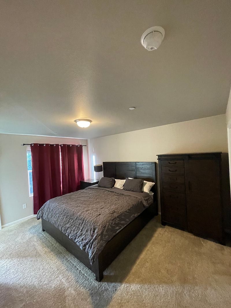 Master bedroom includes a king bed, walk in closet and a full attached bathroom