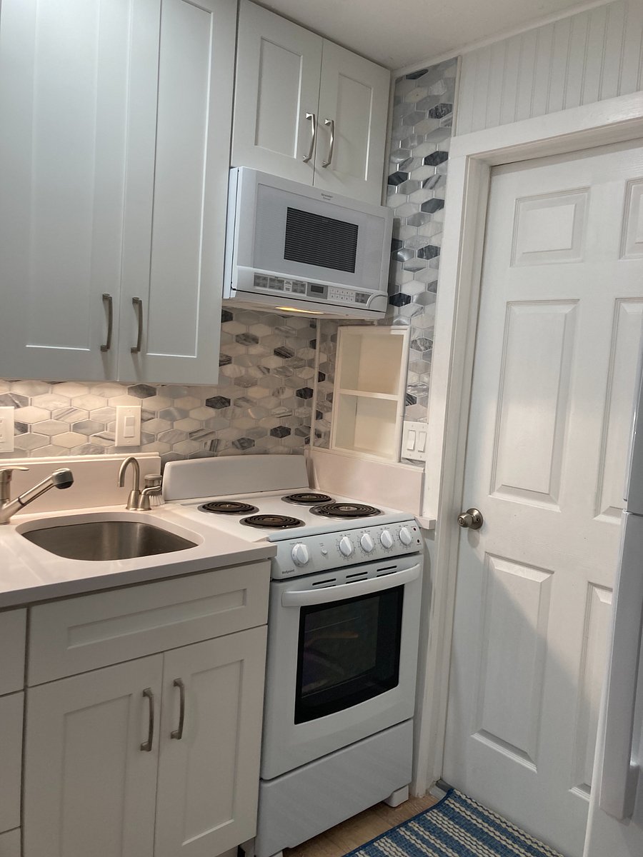 Kitchen & back door (through the shop) with stove, oven, microwave & instant hot water