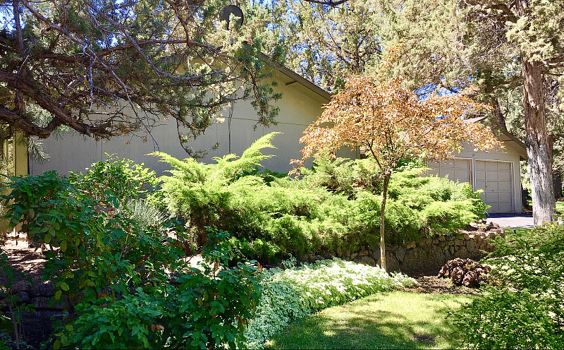Welcome Home! Single level. Front yard is maintained weekly by gardeners. Little covered porch with a sitting bench.