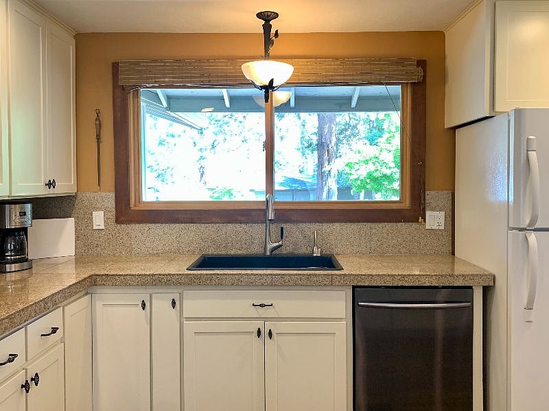 Fully stocked kitchen. Gas range, built-in microwave, coffee maker, and all the pots and pans/dishes/utensils you could ever need.