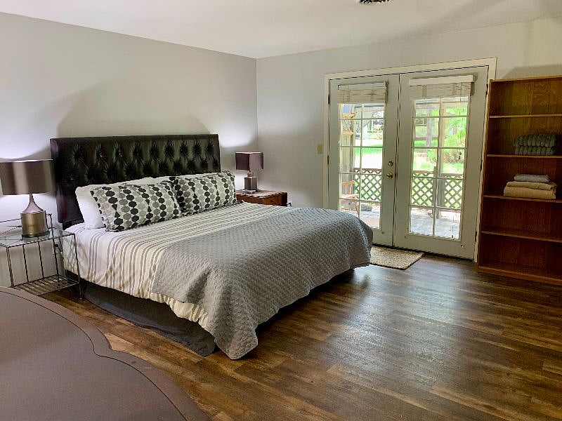 Huge main bedroom suite includes a king temperpedic bed, bathroom, wall of closets and beautiful french doors to the private patio.