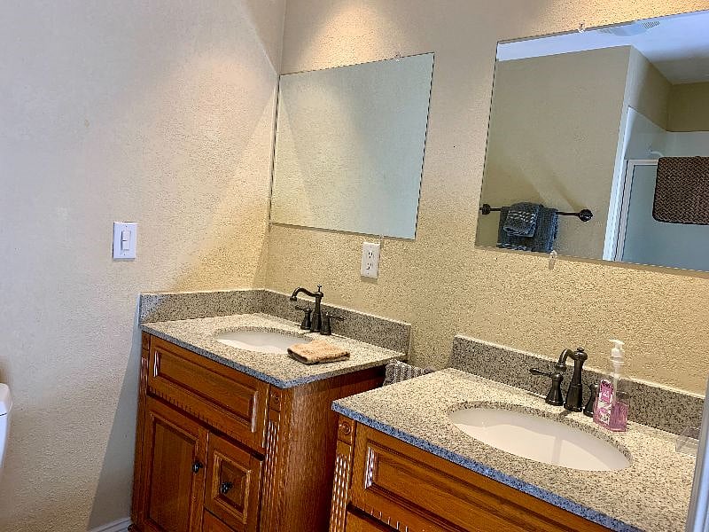 Ensuite bathroom off the main bedroom. Granite counters, keep your space organized with a personal sink and vanity (double sink, one for each of you), and shower.