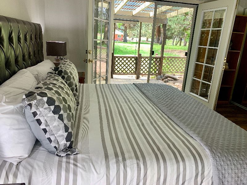 Sleep like a baby in the King-size bed with Tempurpedic mattress and new soft, cushioned headboard! Wake up to large french doors with a view.