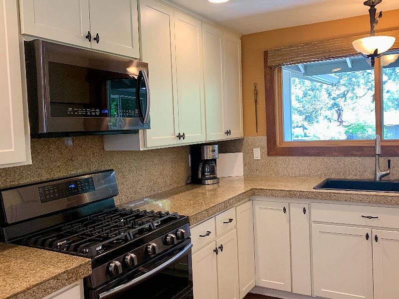 Fully stocked kitchen. Gas range, built in microwave, coffee maker and all the pots and pans/dishes/utensils you would ever need.