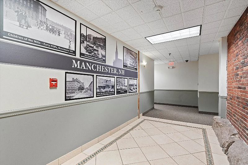 Hallway outside of apartment, near elevator