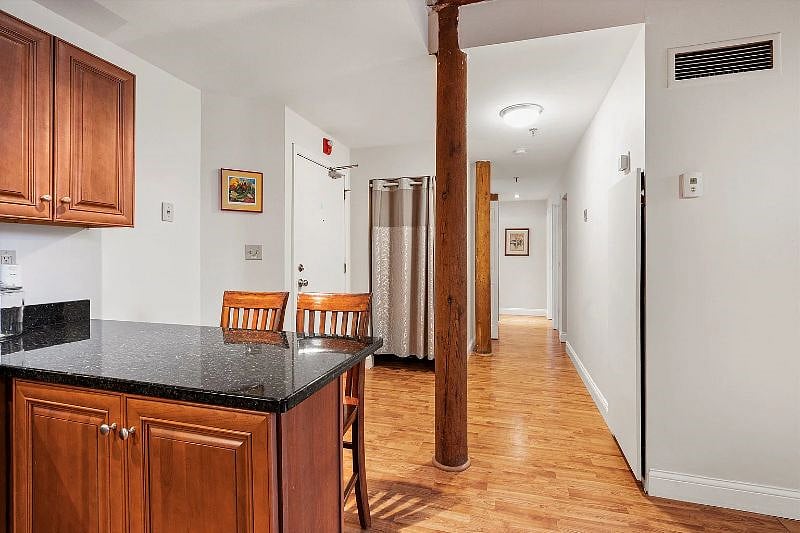 Breakfast bar, apartment entrance, entryway closet, main hallway