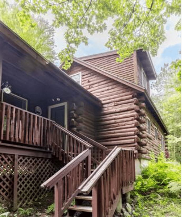 Stairs leading up to the cabin from the driveway