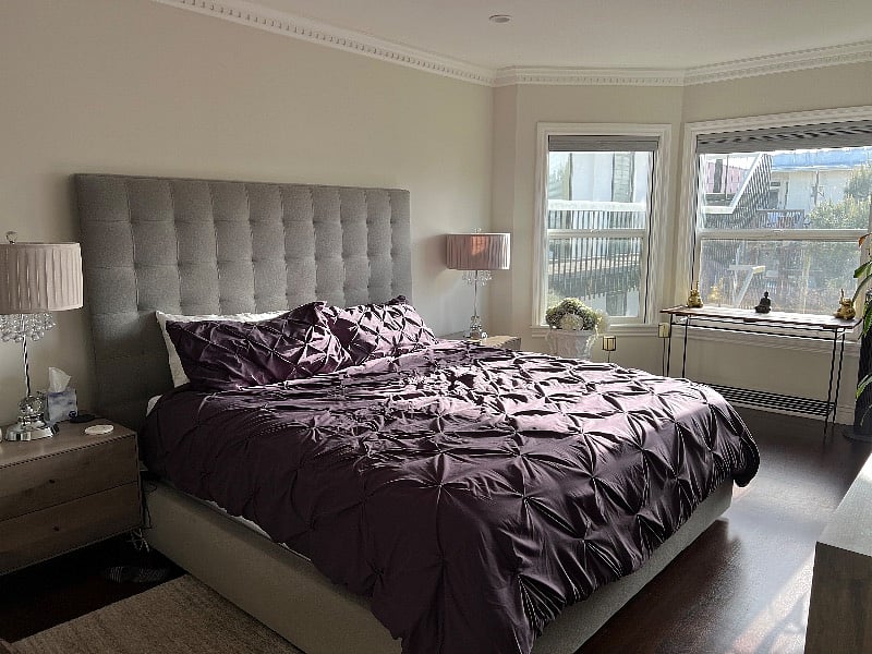 Primary bedroom has bay windows with blackout shades