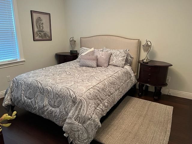 2nd bedroom with closet, night tables and large dresser
