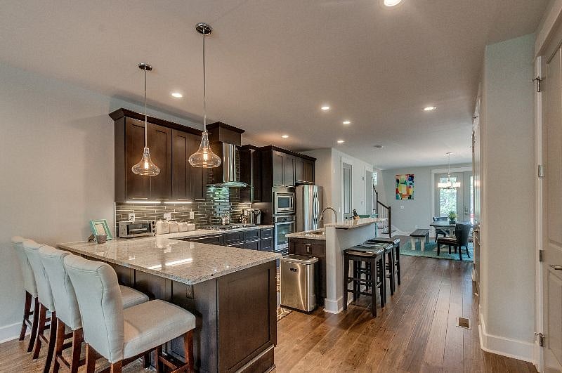 Beautiful Custom Kitchen. Soft touch drawers, stainless steel appliances, Gas Stove. Custom lighting.  4 Counter stools and 3 bar stools providing plenty of seating for entertaining.