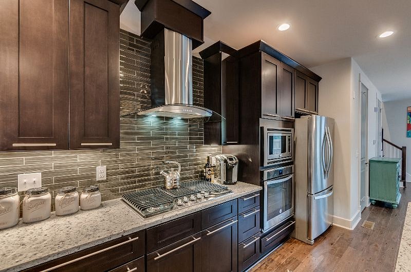 Beautiful Custom Kitchen w/ top of the line stainless steel appliances, 5 burner gas range and all of the essentials. 
